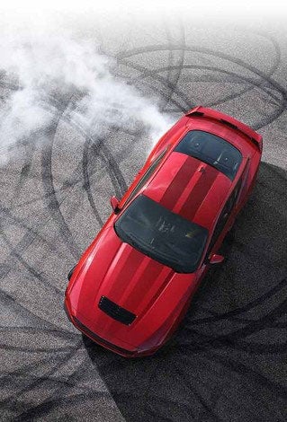 Overhead view of a 2024 Ford Mustang® model with tire tracks on pavement | Lynch Ford of Mukwonago in Mukwonago WI