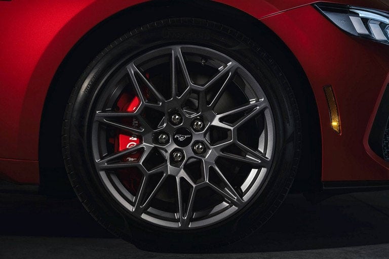 2024 Ford Mustang® model with a close-up of a wheel and brake caliper | Lynch Ford of Mukwonago in Mukwonago WI