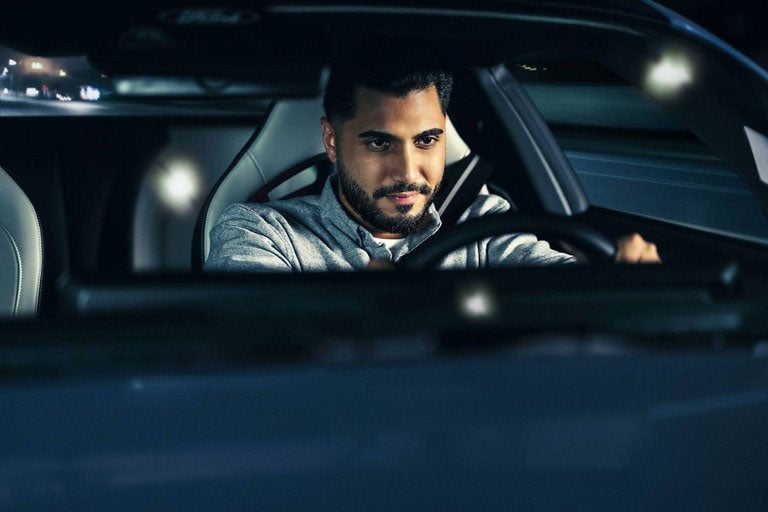 Person sitting in the driver’s seat of a parked 2024 Ford Mustang® coupe | Lynch Ford of Mukwonago in Mukwonago WI