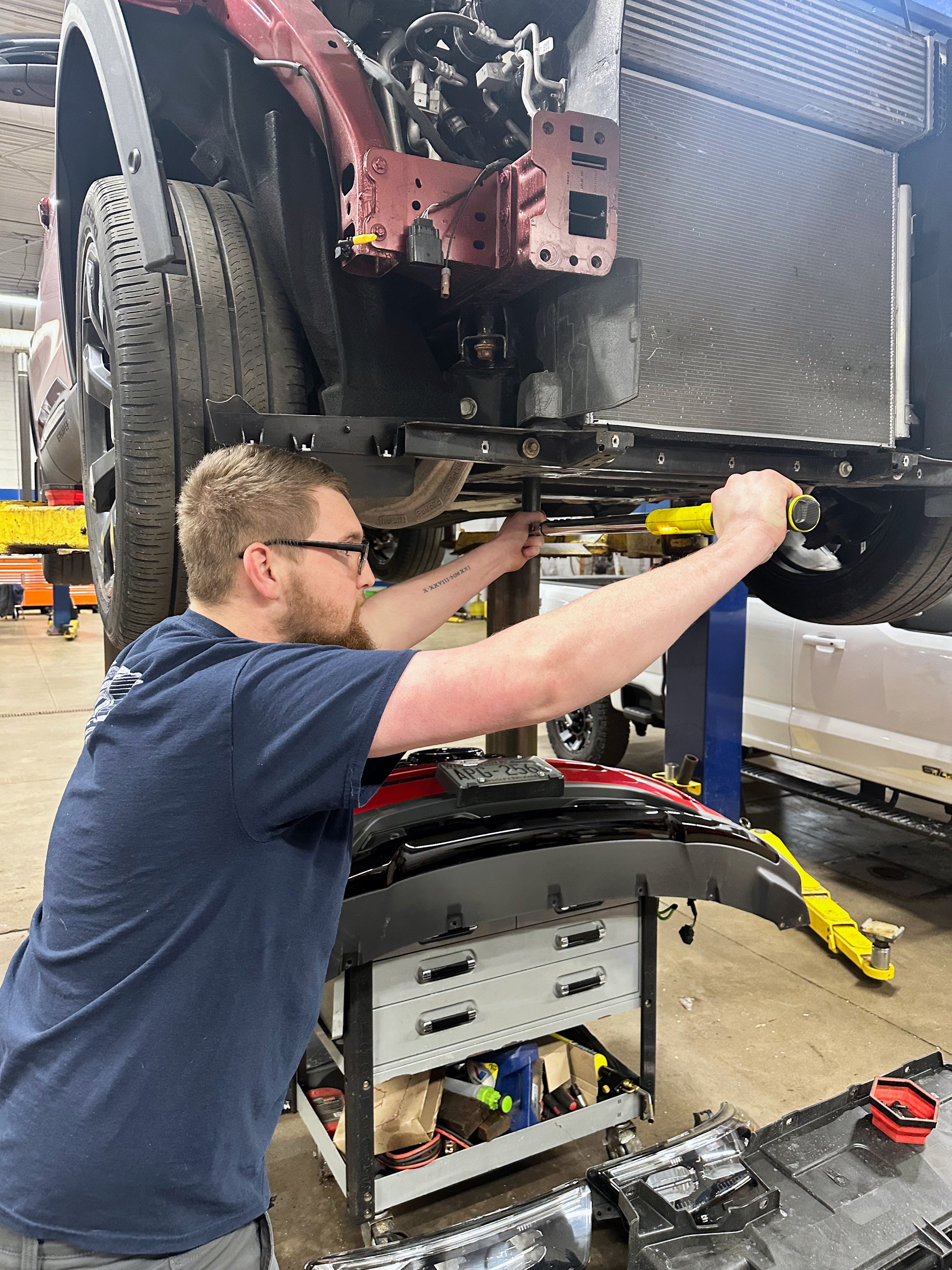 Technician using Torque Wrench